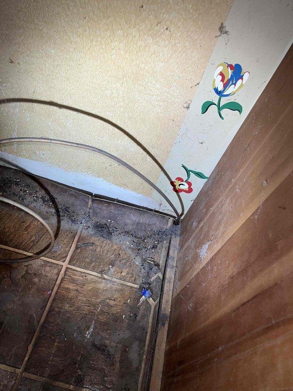 Installed refrigerator water line shutoff valve in 1977-built home, connecting existing copper refrigerator line to accommodate stainless steel refrigerator line connection. Accessed plumbing behind wall framing, installed shutoff valve on copper supply line, and configured connection point for stainless steel appliance line. Work completed successfully with proper valve placement for convenient future appliance access and maintenance.