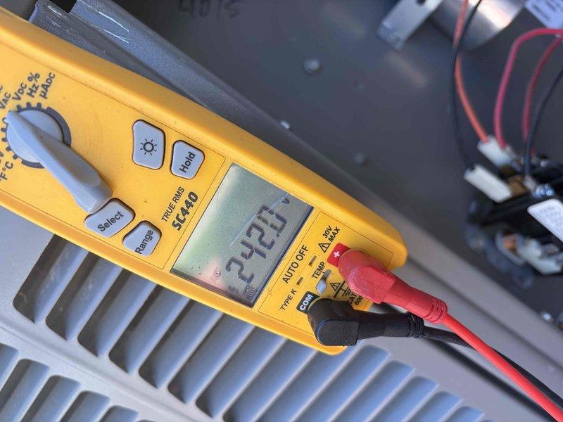 Completed routine cooling maintenance on HVAC system. Performed diagnostic testing and measurements using digital multimeter, recording voltage readings of 27.23V and current measurements of 536A with 0.1A resolution. System requires renewal of service agreement for continued maintenance coverage.