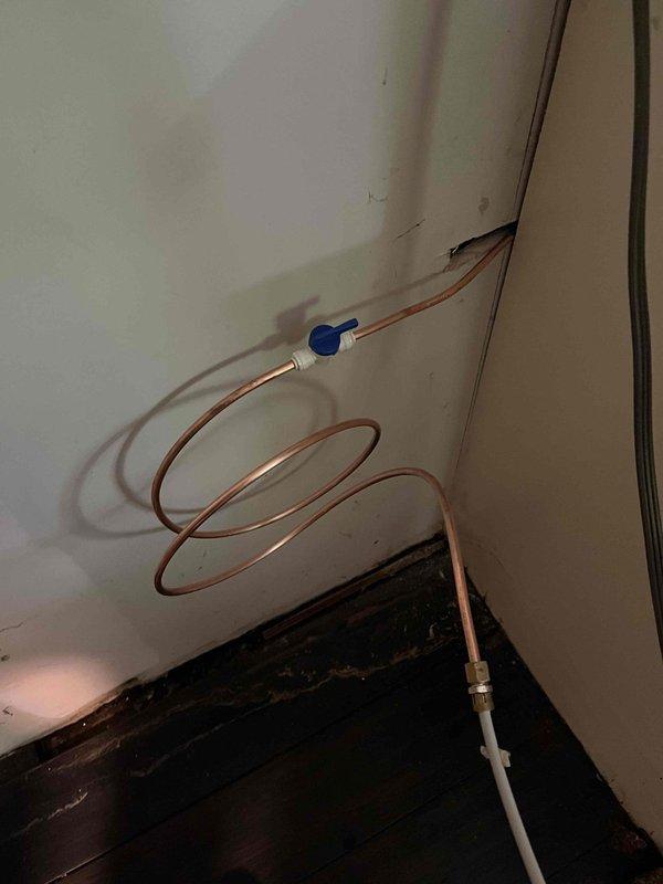 Responded to a water leak originating from the refrigerator supply line. Upon inspection, identified a compromised connection at the copper tubing interface with the appliance feed line. Shut off the water supply at the nearest isolation valve, removed the damaged flexible connector, and installed a new compression fitting with proper sealing. Tested the system under full pressure to verify leak elimination and proper water flow to the refrigerator ice maker and dispenser.