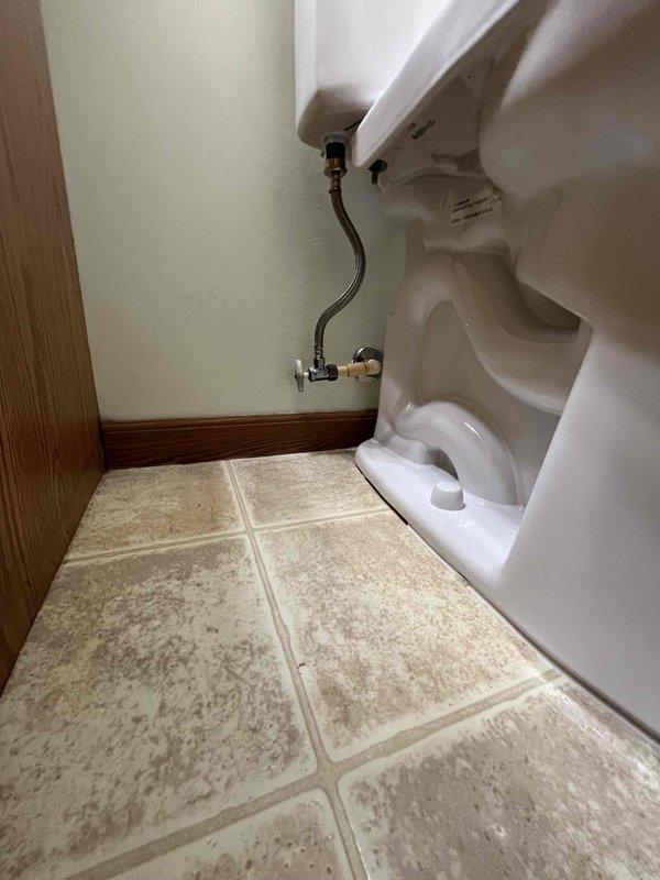 Replaced two toilets in residential bathroom. Removed existing fixtures and installed new white porcelain two-piece toilets with standard flush mechanisms. Connected water supply lines using braided stainless steel flex hoses to existing chrome angle stop valves. Verified proper sealing of wax rings, tested flush operation, and confirmed no leaks at all connection points upon completion.