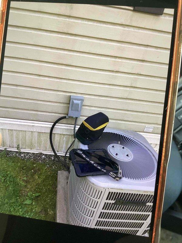 Responded to no cooling complaint following thermostat installation. Upon arrival, found outdoor condensing unit not operating. Performed diagnostic testing using digital multimeter and confirmed system had lost communication between new thermostat and air handler. Measured voltage at condenser unit showing 73.7V reading, indicating power supply issue from air handler. Troubleshot electrical connections and restored proper 24V control voltage to condensing unit. Verified system operation and confirmed air conditioning functionality restored.