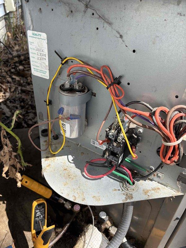 # HVAC Service Report

## Service Performed

Responded to no-cooling call on residential air conditioning system. Upon arrival, unit was completely non-operational with no power to outdoor condenser. Performed diagnostic testing with multimeter on electrical components. Found failed dual-run capacitor (45+1.5 μF, 440 VAC) with visible signs of deterioration and age-related wear. Capacitor showed no charge and tested open on both common and hermetic terminals. Removed defective capacitor and installed new OEM-equivalent dual-run capacitor with matching specifications. Verified all wire connections at contactor and capacitor terminals for tightness and proper polarity. Restored power to unit and confirmed compressor and condenser fan motor startup. System cycled properly with normal amp draw on both circuits. Tested operating pressures and temperatures—all within manufacturer specifications. Unit cooling effectively at time of departure.