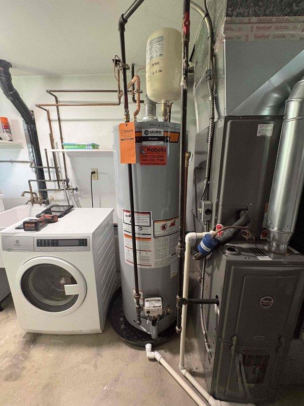 Replaced residential water heater with new unit including installation of Amtrol expansion tank and proper copper piping connections. Connected all supply and discharge lines with appropriate shut-off valves and safety devices. Verified proper operation of new water heater system and ensured all connections were secure and leak-free.