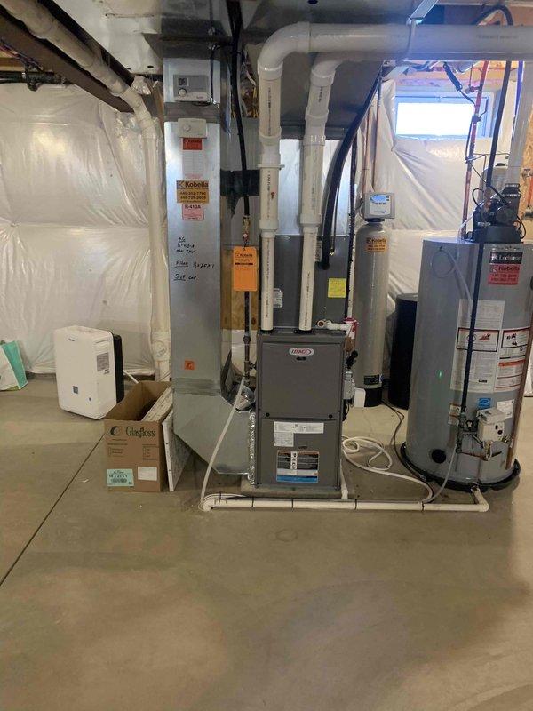Completed final prepaid maintenance visit on air handler system. Performed comprehensive inspection of HVAC equipment in basement mechanical room, verified proper operation of furnace unit and associated components, and documented system voltage reading of 236.5V AC using calibrated multimeter. All equipment found operating within normal parameters with no issues identified.