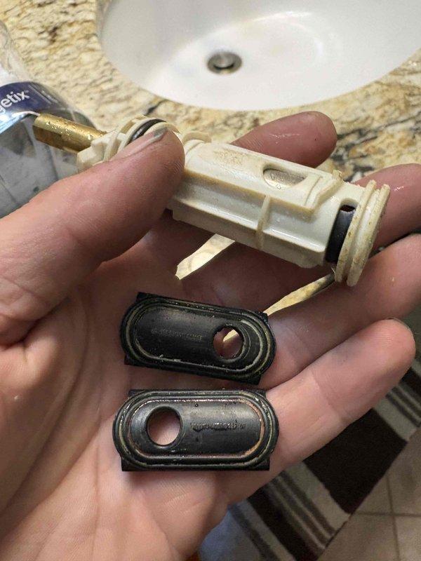 Returned to property to install customer-supplied shower cartridge that was previously sold. Completed installation of the replacement cartridge and performed comprehensive inspection of the entire shower system to ensure proper operation and verify no leaks or additional issues were present. Removed old worn cartridge components showing significant mineral buildup and corrosion, replaced with new parts, and tested all functions to confirm reliable performance before homeowner's upcoming travel.