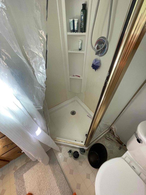 Responded to water leak call at residential property. Upon inspection of bathroom facilities, identified source of moisture issue and completed necessary repairs to plumbing fixtures. Verified proper operation of shower enclosure, checked all connections and seals, and confirmed no active leaks present. All fixtures tested and functioning properly upon completion.