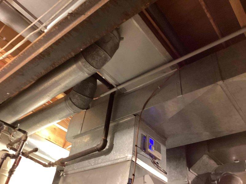 Completed full HVAC system replacement in basement mechanical room. Installed new air handler unit with integrated digital controls, connected to existing ductwork infrastructure with proper sealing and support. Configured metallic supply and return ductwork with insulated connections to optimize airflow distribution throughout the residence. Verified all electrical connections, refrigerant lines, and condensate drainage are properly installed and operational. System tested and confirmed functioning within manufacturer specifications.