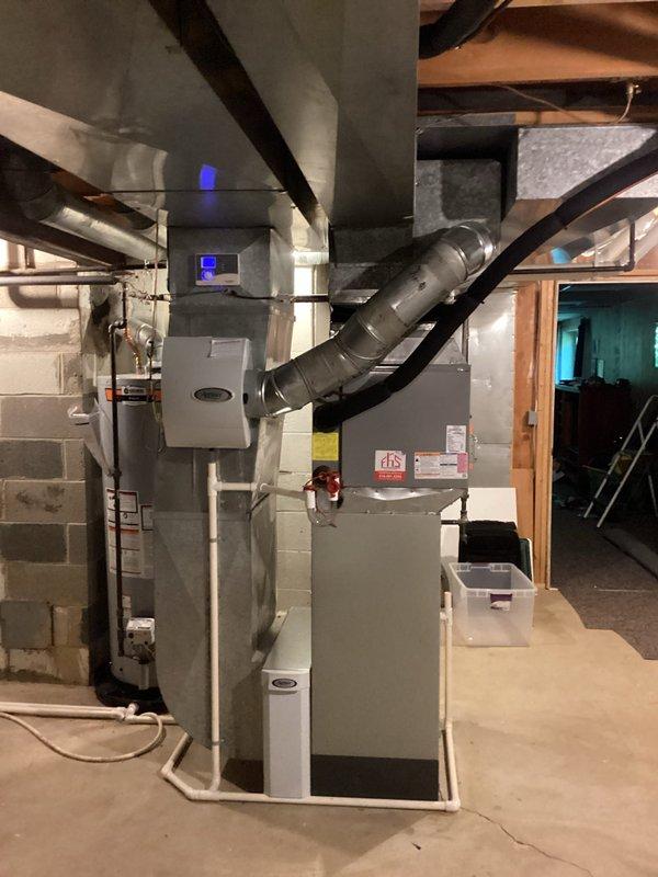 Completed full HVAC system replacement in basement mechanical room. Installed new air handler unit with integrated digital controls, connected to existing ductwork infrastructure with proper sealing and support. Configured metallic supply and return ductwork with insulated connections to optimize airflow distribution throughout the residence. Verified all electrical connections, refrigerant lines, and condensate drainage are properly installed and operational. System tested and confirmed functioning within manufacturer specifications.