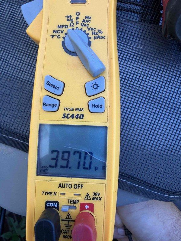 Completed cooling maintenance club visit on air handler system. Performed routine inspection and testing of electrical components, verified proper voltage readings at disconnect box measuring 397.0 microamps, and documented equipment condition through photographs. All systems operating within normal parameters.