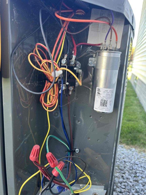 Completed club membership renewal maintenance visit on air handler system. Performed comprehensive electrical inspection, accessing interior compartment to examine contactor, capacitor, and associated wiring connections. Utilized Fieldpiece SC440 meter to verify electrical readings, measuring 245.3 on capacitor to ensure proper system operation and component functionality.
