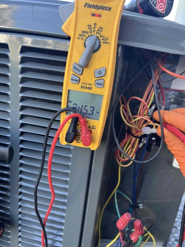 Completed club membership renewal maintenance visit on air handler system. Performed comprehensive electrical inspection, accessing interior compartment to examine contactor, capacitor, and associated wiring connections. Utilized Fieldpiece SC440 meter to verify electrical readings, measuring 245.3 on capacitor to ensure proper system operation and component functionality.