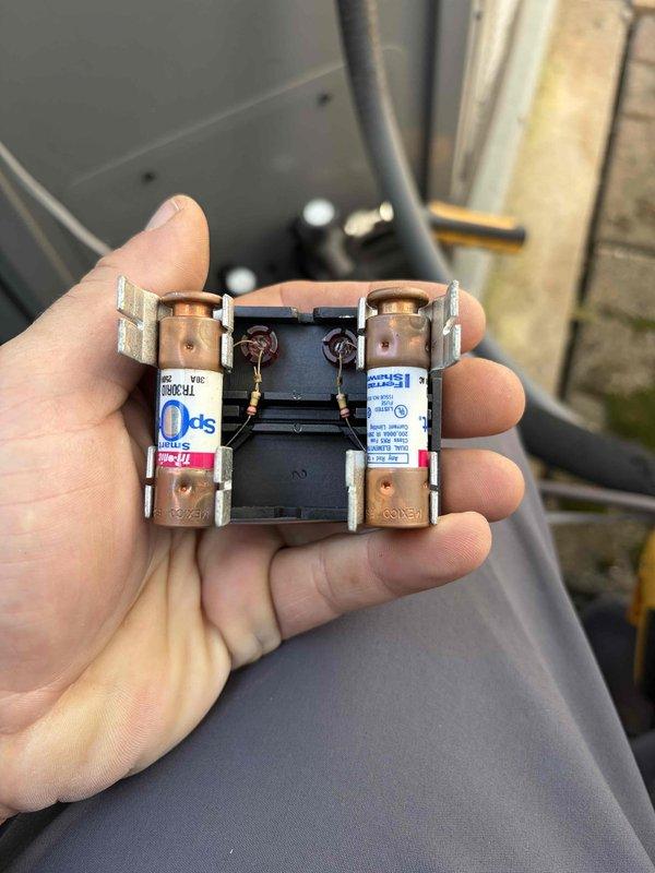 Completed comprehensive tune-up on air handler unit. Inspected and tested contactor for proper operation, verified electrical connections and terminal integrity, and confirmed voltage readings at 233.3V using calibrated multimeter. All components found operating within normal parameters.