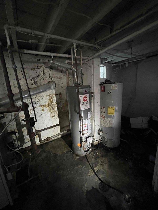 Installed customer-supplied tanked water heater in basement mechanical room. System was properly connected to existing plumbing infrastructure, pressure tested at approximately 120 psi, and verified operational with all safety components functioning correctly.