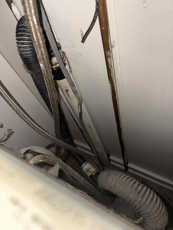 Responded to service call for clogged kitchen sink and bathroom sink. Upon arrival, accessed plumbing system through basement utility area to locate and address drainage obstruction. Inspected exposed drain lines, PVC piping, and water supply lines in crawl space and basement areas. Successfully cleared blockages in both affected drains, restoring proper water flow and drainage function to kitchen and bathroom sinks. Verified all connections were secure and tested drainage system to ensure complete resolution of clogging issues.