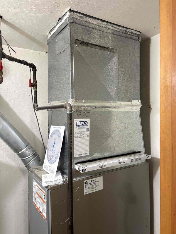 Evaluated existing HVAC system consisting of a 10-year-old furnace and 1989 air conditioning unit for replacement options. Assessed current equipment condition, ductwork connections, and system configuration in basement installation to provide comprehensive replacement recommendations for aging cooling system while considering compatibility with existing furnace unit.