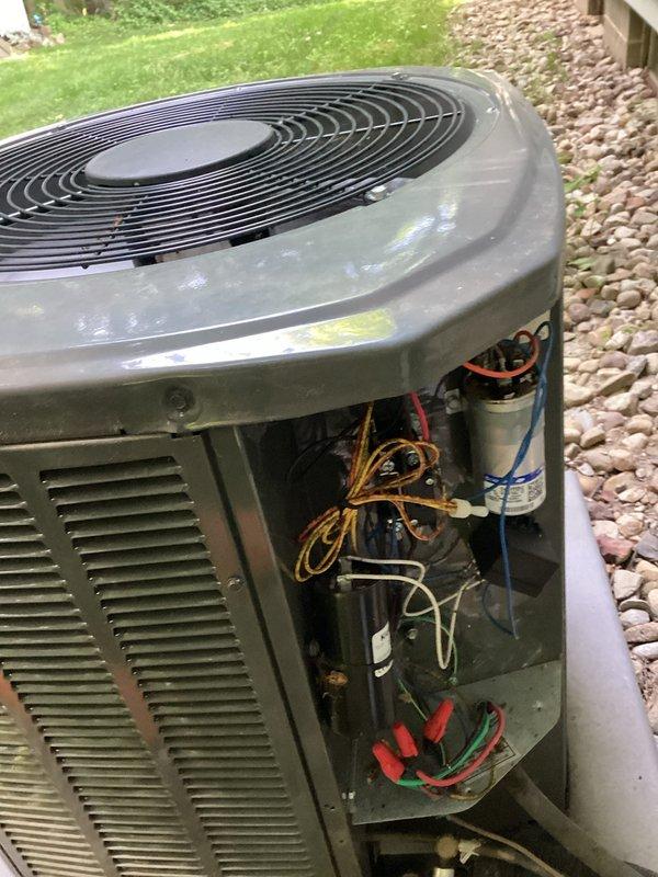 Completed routine cooling maintenance club visit on residential air conditioning system. Performed comprehensive inspection of outdoor condensing unit, including removal of access panel to examine electrical components, capacitor, wiring connections, and internal mechanical systems. Verified proper operation of compressor, condenser fan motor, and all electrical connections. Inspected capacitor for signs of bulging or deterioration, checked voltage and amperage readings using diagnostic gauges to ensure system operating within manufacturer specifications. All components found to be functioning properly with no immediate repairs required. Unit exterior showed normal weathering consistent with outdoor exposure, with system maintaining adequate cooling performance.