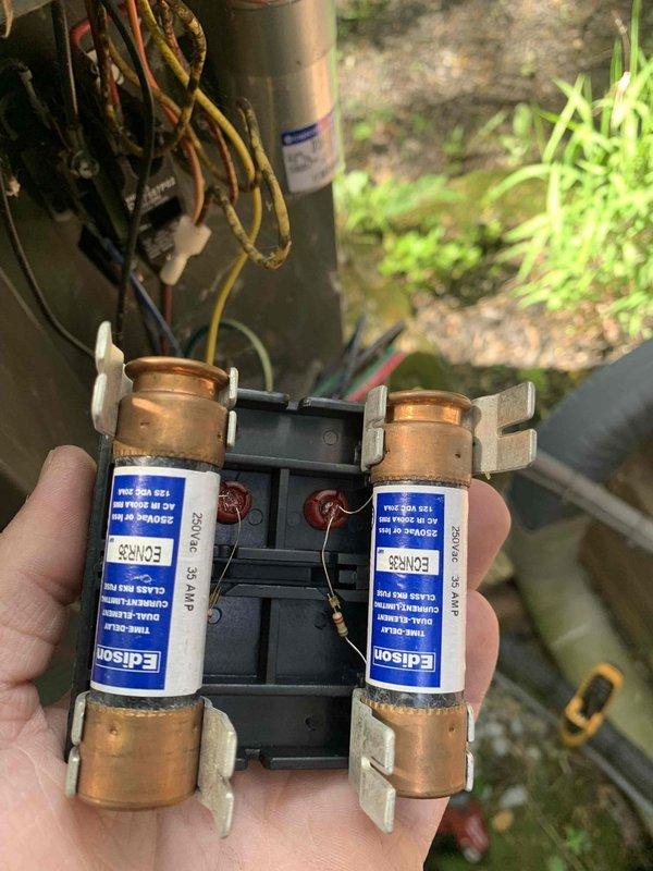 Completed final prepaid club maintenance visit on air handler system. Inspected and documented dual Edison brand fuses (250VAC 2 AMP rating) with proper copper end caps and red wire connections in working condition. Verified all electrical components, capacitor, and associated wiring connections secure and operational. Updated service tag with maintenance record for tracking system history.