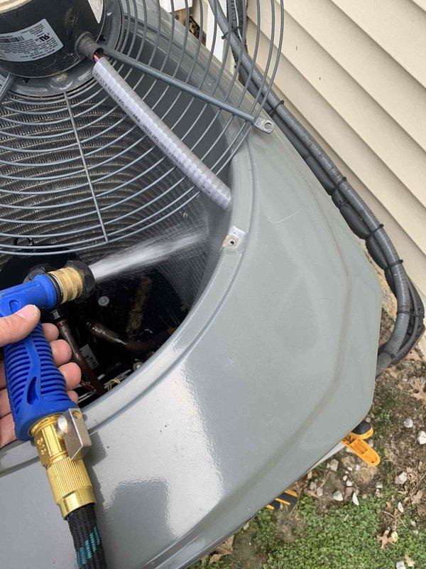 Completed cooling maintenance club visit on residential air handler system. Performed exterior cleaning of HVAC unit using pressure washing equipment to remove debris, dirt, and biological growth from condenser casing and surrounding area. Inspected unit components including fan assembly, electrical conduit connections, and refrigerant line fittings. All equipment operating within normal parameters upon completion of maintenance procedures.