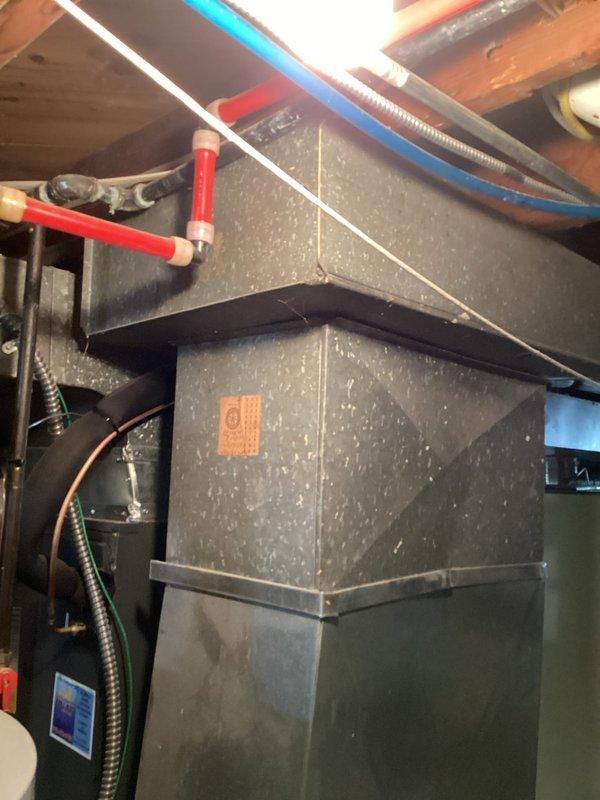 Conducted comprehensive assessment of existing HVAC system and ductwork infrastructure in basement utility area for equipment replacement estimate. Documented current installation including main supply plenum, sheet metal ductwork configuration, flexible duct runs, and mechanical connections. Evaluated accessibility of existing system components, structural clearances with floor joists, and integration points with plumbing and electrical systems to determine replacement requirements and specifications.
