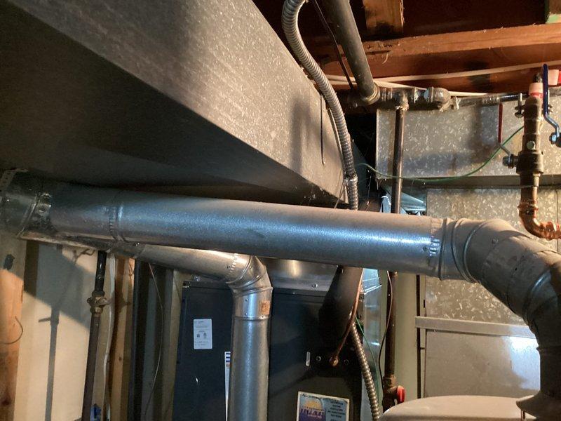 Conducted comprehensive assessment of existing HVAC system and ductwork infrastructure in basement utility area for equipment replacement estimate. Documented current installation including main supply plenum, sheet metal ductwork configuration, flexible duct runs, and mechanical connections. Evaluated accessibility of existing system components, structural clearances with floor joists, and integration points with plumbing and electrical systems to determine replacement requirements and specifications.