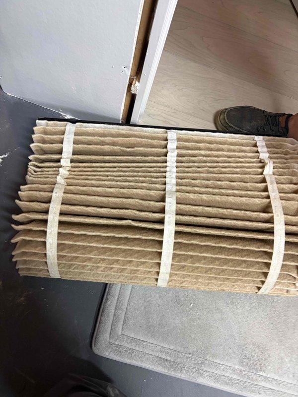 Completed preventive maintenance tune-up on HVAC system exceeding 10 years of age. Inspected and photographed accordion-style pleated air filter showing dust accumulation, and documented OptiAire system component with stock number 2213. Customer enrolled in maintenance club membership program for ongoing service coverage.