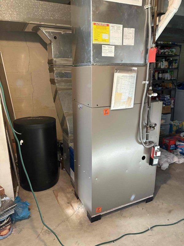 Completed HVAC estimate for air conditioning system replacement at residential property. Assessed existing furnace installation, ductwork configuration, and electrical service panel capacity to determine requirements for new AC unit installation. Documented current equipment setup including furnace location in basement utility area, existing duct connections, and available electrical circuits for proper system integration and load calculations.
