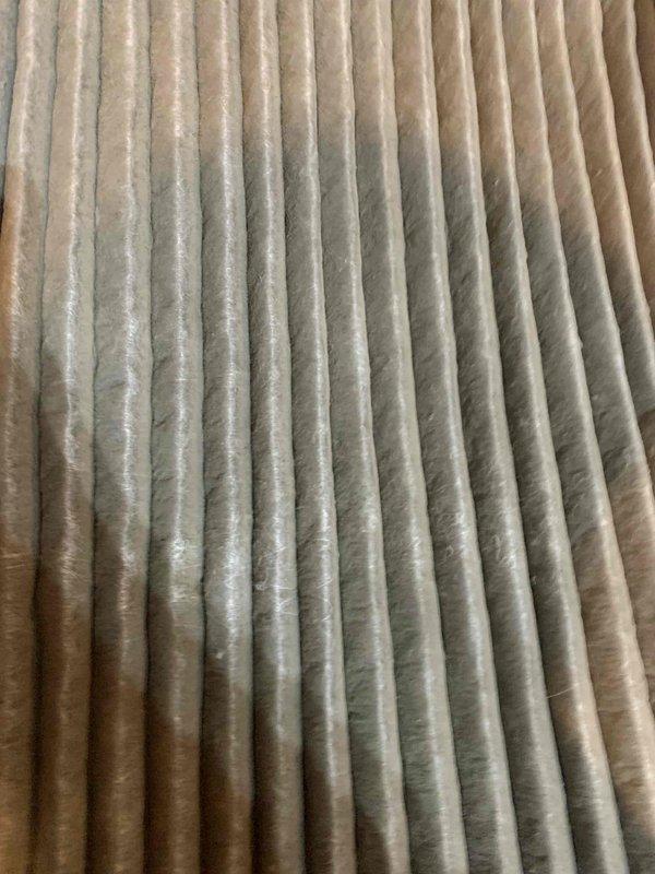 Completed annual air conditioning tune-up on air handler unit. Inspected and documented condition of air filter showing moderate dust accumulation and replaced with new filter to restore proper airflow and system efficiency. Performed standard maintenance inspection of outdoor condensing unit, verifying proper operation and documenting equipment condition.
