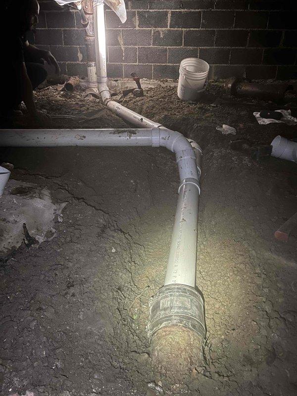 Completed spot repair on broken plumbing line in crawl space beneath residence. Installed dirt leg on gas line per code requirements to protect equipment and ensure proper sediment collection. All repairs tested and verified operational.