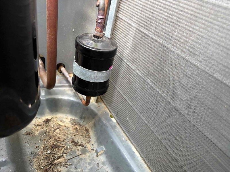 Returned to property to complete compressor replacement under parts warranty. Removed failed compressor from outdoor condensing unit and installed new replacement unit. Brazed copper refrigerant line connections to new compressor, completed evacuation and system recharge, and restored system to full operational status.