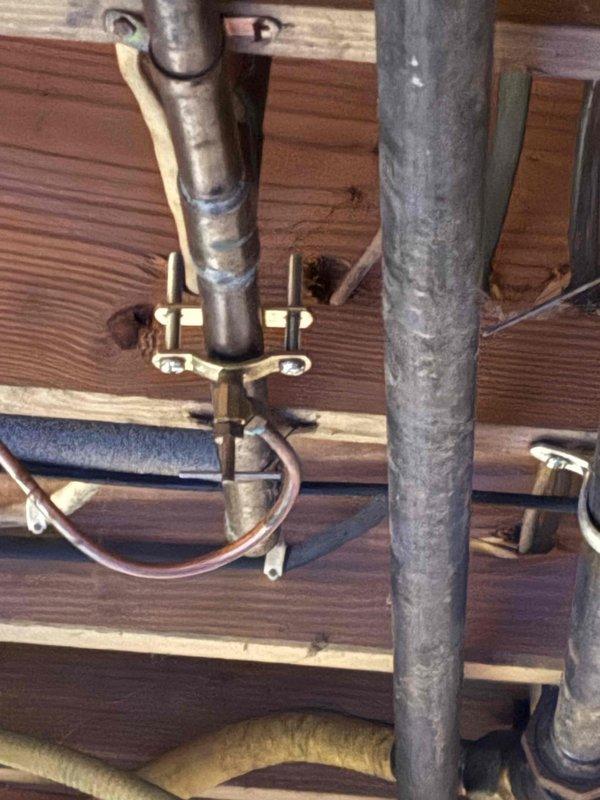 Responded to service call for air conditioning system not blowing air inside residence with unknown equipment age. Conducted comprehensive system evaluation and documented existing HVAC infrastructure including ductwork connections, electrical panel configuration with multiple circuits serving various household systems, and current equipment installation. Assessed plumbing and mechanical components in crawlspace area showing aged galvanized piping, copper refrigerant lines, and insulated supply lines. Evaluated electrical service panel containing circuit breakers for major appliances and HVAC equipment to determine power availability and capacity for replacement system. Prepared detailed estimate for complete HVAC system replacement based on findings from visual inspection and equipment assessment.