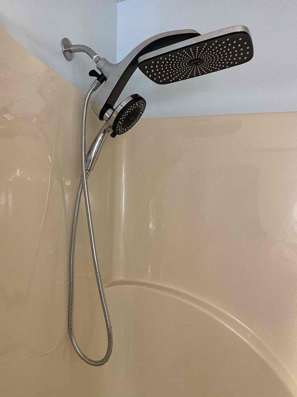 Responded to report of intermittent clunking sounds from bathroom toilet and bathtub backing up. Upon inspection, diagnosed drainage system issue affecting bathroom fixtures. Cleared blockage in main drain line to restore proper drainage flow and eliminate backup condition. Verified toilet operation and confirmed elimination of unusual sounds. Tested bathtub drainage to ensure complete resolution of backup issue and proper water flow through drain system.