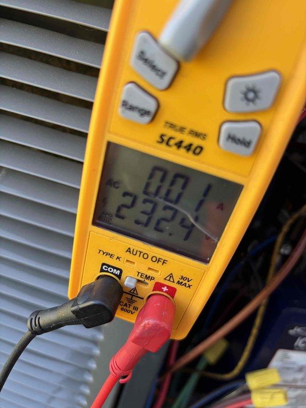 Completed cooling maintenance club visit on air handler system. Performed comprehensive electrical diagnostics using digital multimeter, recording voltage readings of 232V and amperage draw of 49.3A to verify proper system operation and motor performance. Inspected and tested motor capacitor to ensure adequate charge and functionality. Evaluated all electrical connections, wiring, and components for secure installation and proper operation. Documented equipment conditions with photographs for maintenance records. System operating within normal parameters upon completion of maintenance visit.