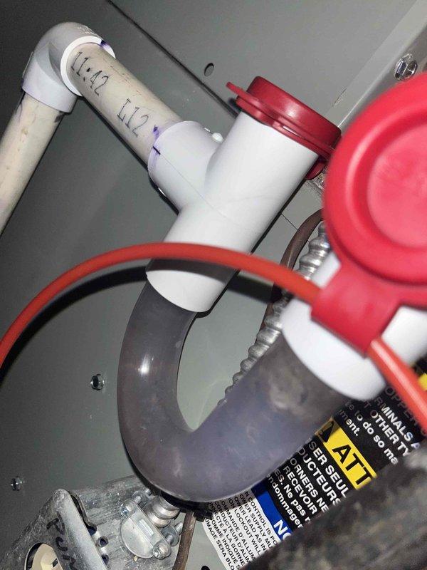 Completed scheduled cooling maintenance for club member's air handler unit. Performed comprehensive inspection of electrical components, noting corrosion and oxidation present on terminal connections and mounting hardware that will require monitoring. Inspected condensate drain system and associated plumbing connections, verifying proper operation of drain line, trap assembly, and safety overflow mechanisms. All system components photographed and documented for maintenance records.