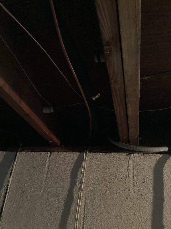 Conducted on-site assessment for complete HVAC system replacement. Inspected existing thermostat wiring and terminal connections, documenting current configuration for replacement specifications. Evaluated attic-mounted air handler and ductwork accessibility, photographed existing installation conditions, and provided comprehensive replacement estimate for aging air conditioning system.
