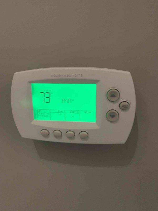Responded to customer concern regarding insufficient heating. Performed system diagnostic and refrigerant charge verification on air conditioning unit. Thermostat displaying 73°F ambient temperature with setpoint at 65°F, indicating system operating within normal parameters at time of inspection.