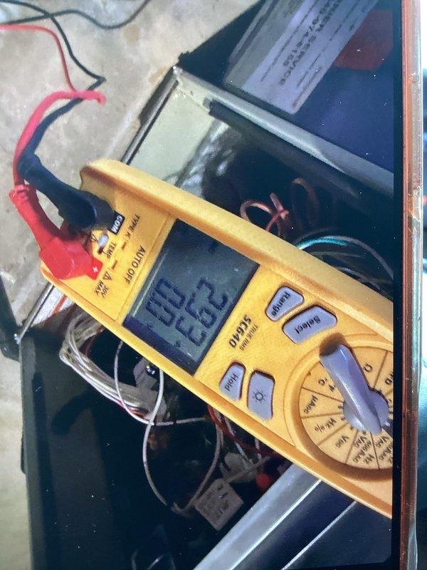 Completed cooling maintenance club visit for member. Performed comprehensive electrical diagnostics on HVAC system using digital multimeter, measuring voltage and amperage readings at both the indoor control panel and outdoor unit electrical connections. All electrical parameters tested within manufacturer specifications, with readings of 85.0V, 12.2V, and 65.5V recorded at various test points. Inspected wiring connections at exterior wall penetration point and noted minor wear on conductor insulation. System operating normally with no deficiencies requiring immediate attention.