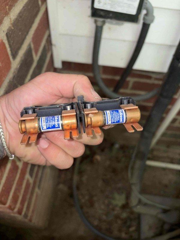 Completed routine cooling maintenance member visit on HVAC system. Performed electrical diagnostics using digital multimeter, recording voltage reading of 57.5V at system components. Inspected and tested dual copper fuses in outdoor disconnect, verifying proper amperage rating and electrical connections. Both fuses showed no signs of damage or deterioration and were functioning within normal parameters. All electrical components tested and confirmed operational for continued system performance.