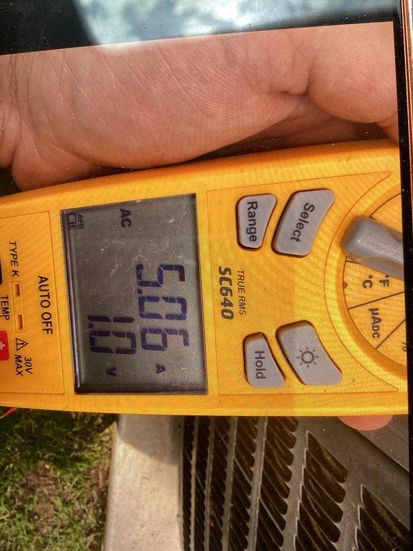 Responded to no cooling call on R-22 system with outdoor fan not running. Upon arrival, confirmed thermostat display operational and unit was shut off as instructed due to ice formation. Performed diagnostic testing using digital multimeter, recording 50.0 reading at outdoor unit. Connected refrigerant gauges and measured system pressures and temperatures: suction side reading 78.8 psig at 47.9°F with vapor saturation of 46.5°F showing 1.4°F actual superheat; liquid side reading 275.9 psig at 119.7°F with liquid saturation of 124.3°F showing 4.6°F actual subcooling. System pressures and subcooling within acceptable range, but low superheat indicated restricted airflow condition. Outdoor fan motor confirmed inoperative, preventing proper heat rejection from condenser coil which caused ice formation on indoor evaporator coil. Diagnosed failed condenser fan motor as root cause of no cooling complaint.