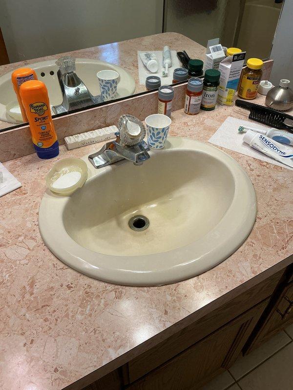 Completed plumbing membership maintenance visit and replaced the water filter as requested. Inspected bathroom plumbing fixtures including vanity faucet, shower valve assembly, and tub spout, confirming all components are functioning properly with no visible leaks or operational issues.