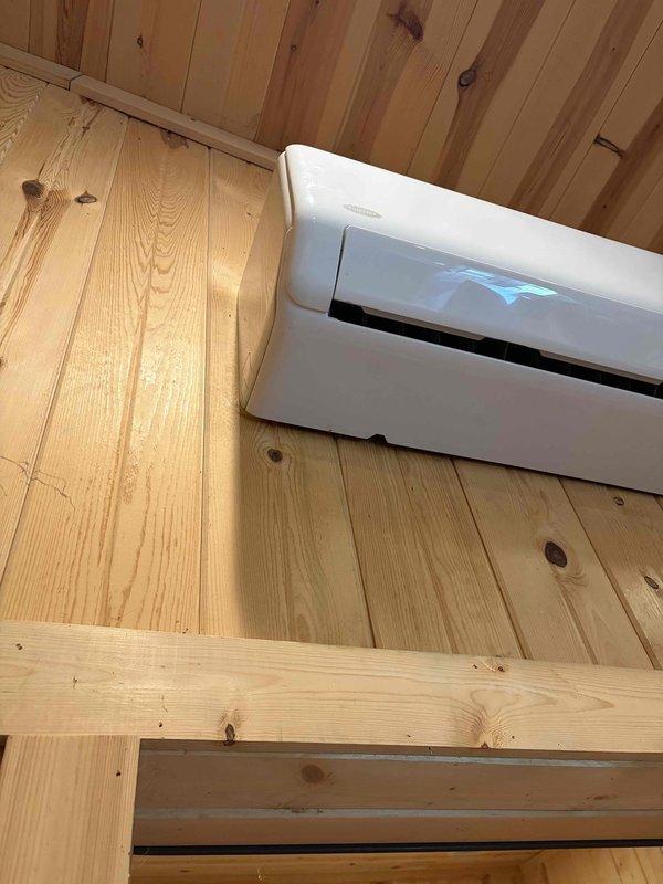 Returned to service call for wall-mounted ductless mini-split system installed in wood-paneled interior space to address drain tube replacement. Ordered replacement drain tube component from RSC Valley View for customer pickup, with estimated arrival in 7-10 business days from order date. Customer will be contacted when part is available for installation completion.
