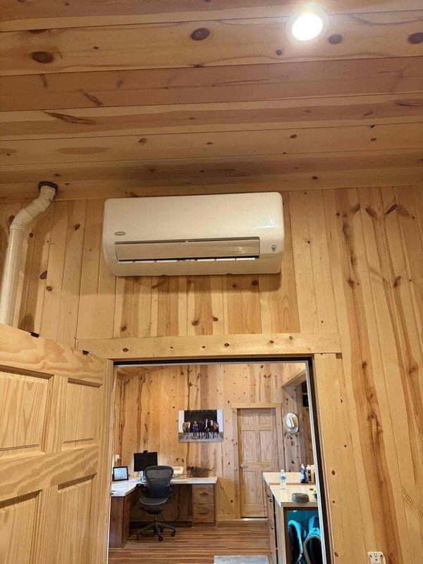 Returned to service call for wall-mounted ductless mini-split system installed in wood-paneled interior space to address drain tube replacement. Ordered replacement drain tube component from RSC Valley View for customer pickup, with estimated arrival in 7-10 business days from order date. Customer will be contacted when part is available for installation completion.