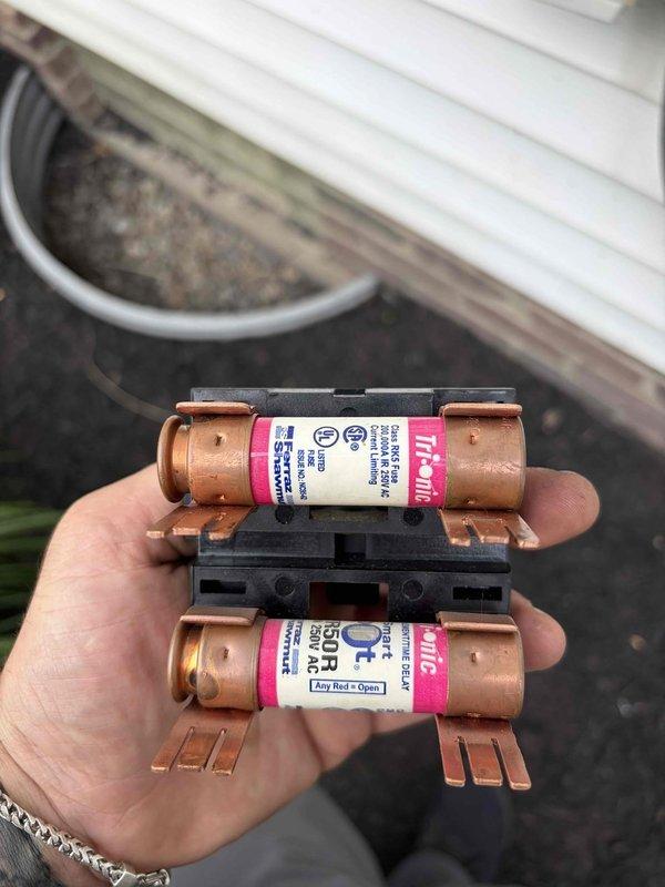 Responded to service call for thermostat displaying error code 114 and continuous blower operation even when system was switched off at furnace disconnect. Upon inspection, located failed fuses in exterior disconnect box. Replaced defective fuses with new Buss-Tron fuses, restoring proper system operation and resolving thermostat error code.