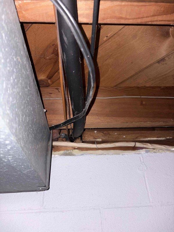 Completed comprehensive HVAC system evaluation for residential property requiring air conditioning replacement. Assessment included inspection of existing attic-mounted equipment, refrigerant line routing through structural framing, ductwork configuration, and exterior electrical service infrastructure to determine specifications and requirements for new system installation.