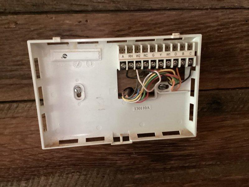 Completed HVAC system assessment for heat pump replacement estimate. Current heat pump failed several years ago, with system operating on emergency heat only via existing air handler. Customer requested quote for new furnace and heat pump combination system compatible with propane fuel source. Documented existing thermostat wiring configuration and evaluated installation location for proposed equipment upgrade.