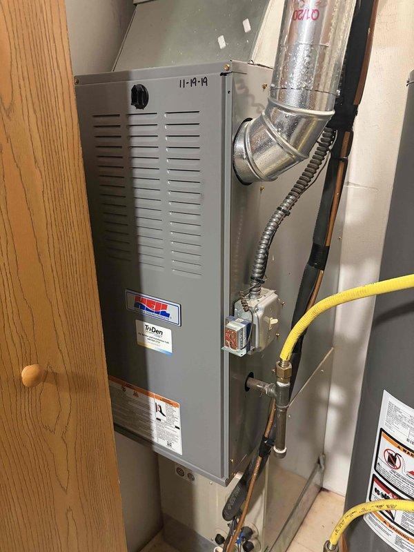Responded to no cooling complaint with unit blowing lukewarm air. Upon arrival, inspected residential HVAC system and found evaporator coil with dust and debris accumulation affecting heat transfer efficiency. Examined refrigerant connections and confirmed no visible ice formation on unit at time of inspection. Verified thermostat operation and system response. Cleaned evaporator coil fins to restore proper airflow and heat exchange capacity. Checked refrigerant line connections and service ports for proper operation. System restored to normal cooling function with improved air temperature output.