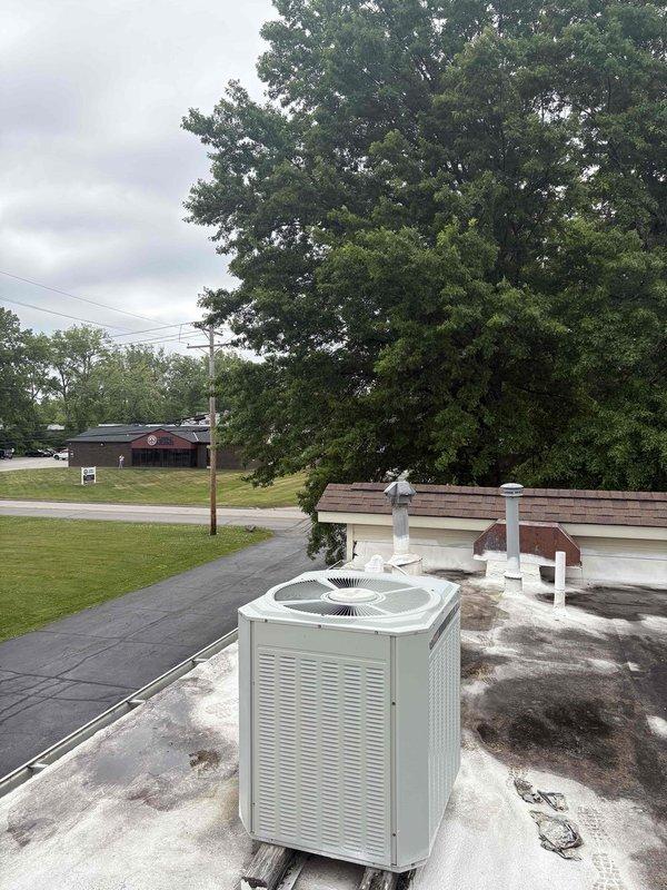 Completed commercial mini-split system estimate for office space. Assessed rooftop conditions and existing HVAC infrastructure on flat membrane roof with multiple commercial units present. Customer also inquired about repair options for failed AC unit but elected to review mini-split estimate before scheduling emergency service appointment.