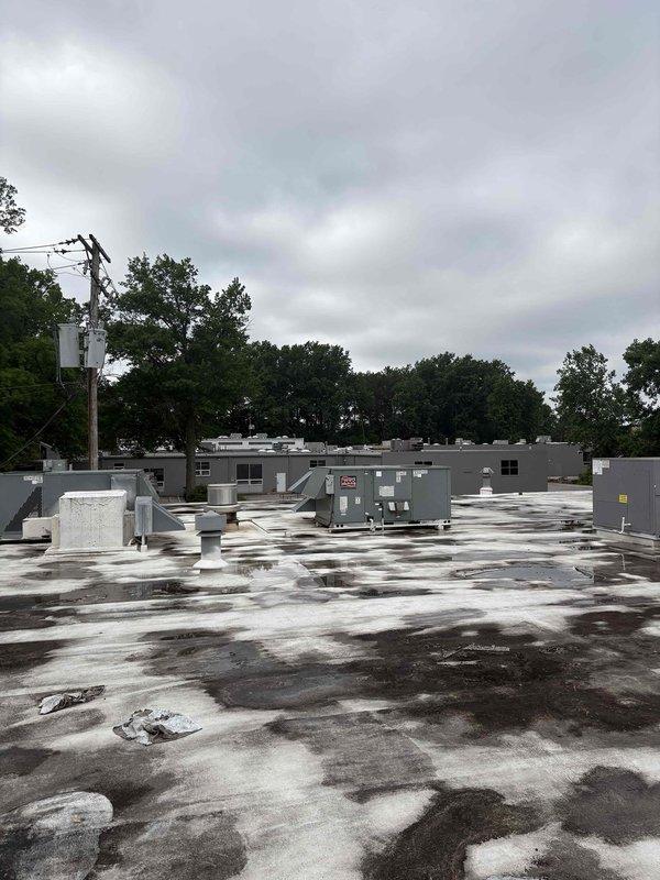 Completed commercial mini-split system estimate for office space. Assessed rooftop conditions and existing HVAC infrastructure on flat membrane roof with multiple commercial units present. Customer also inquired about repair options for failed AC unit but elected to review mini-split estimate before scheduling emergency service appointment.