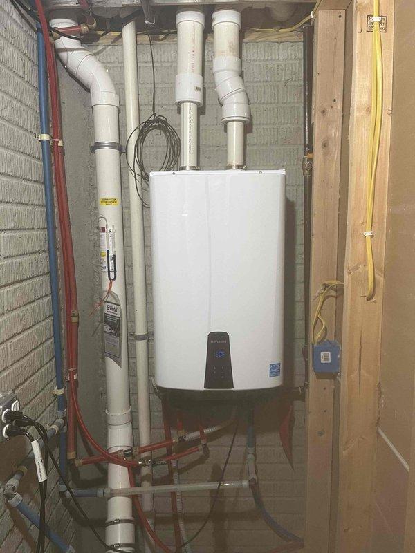 Performed routine maintenance flush on wall-mounted tankless water heater unit in 13-year-old residential property. Isolated water supply lines, connected flush equipment to service valves, and circulated descaling solution through heat exchanger to remove mineral buildup and sediment accumulation. Inspected all copper supply connections, PVC venting system, condensate drain pan, and electrical connections for proper operation. Unit returned to normal service with optimal flow rates restored and no issues identified.