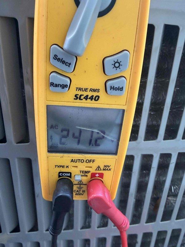 Responded to service call for noise concern on one-year-old replacement A/C unit that occurs during shutdown cycle. Performed system diagnostics and measured operating voltage at 24.12 VAC and amperage reading of 4474, confirming unit is functioning within normal parameters. Advised customer that shutdown noise is typical for this equipment and does not indicate impending failure.
