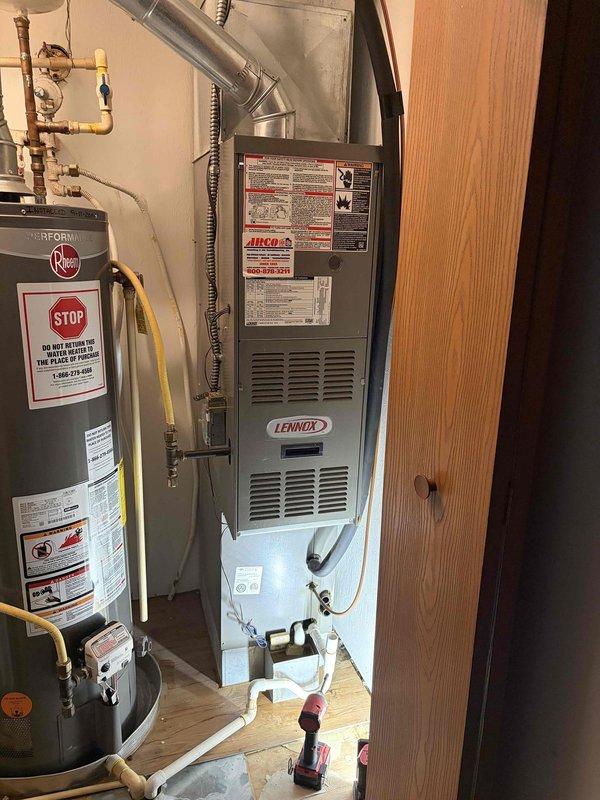 Responded to emergency service call for AC unit causing water damage from rooftop installation. Upon inspection, located source of flooding and addressed drainage issue to prevent further water intrusion into the residence. Documented equipment condition including exterior electrical components and indoor HVAC system configuration for service records.
